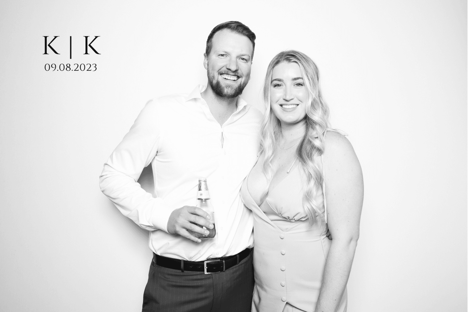 Black and white K and K photo booth print on a clean white backdrop